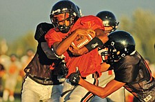 Ronan junior Dustin Goldsby runs with the ball during the Orange/Black Scrimmage last Friday in Ronan.