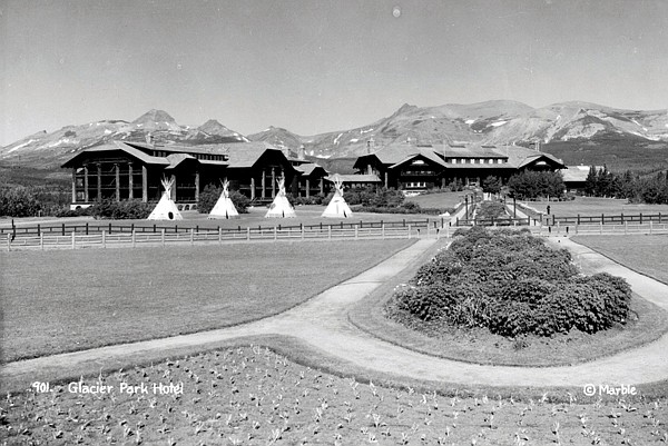 &lt;p&gt;National Park Services; Glacier National Park Archives/Photo by Marble, R.E. View of the front (east side) of the Glacier Park Lodge with landscaped ground in foreground and four Blackfoot Indians tipis set up on lawn. Located in East Glacier, circa 1920.&lt;/p&gt;