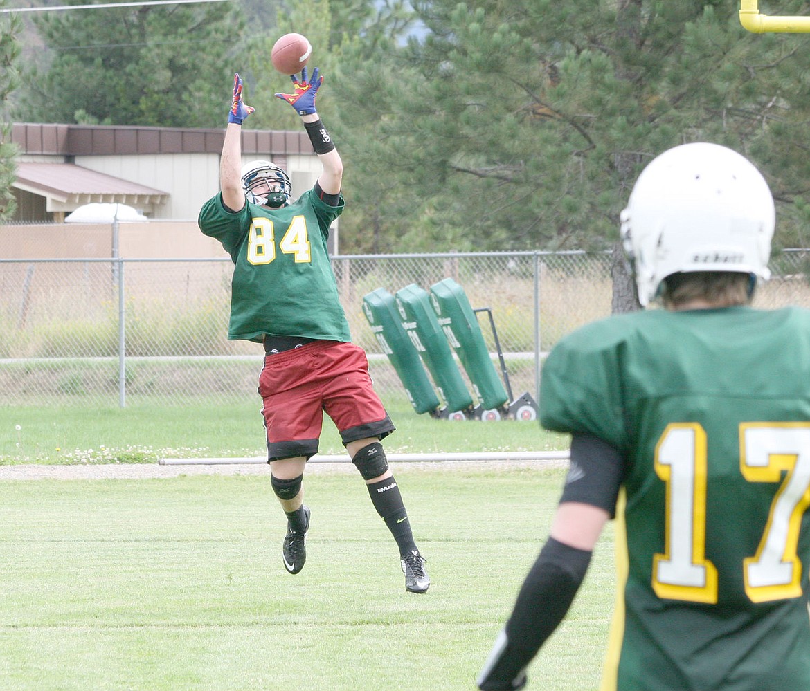 &lt;p&gt;St. Regis Tiger football starting quarterback Dakota Wickham, left, receives a pass during a recent practice in preparation for the team's first game of the season.&lt;/p&gt;