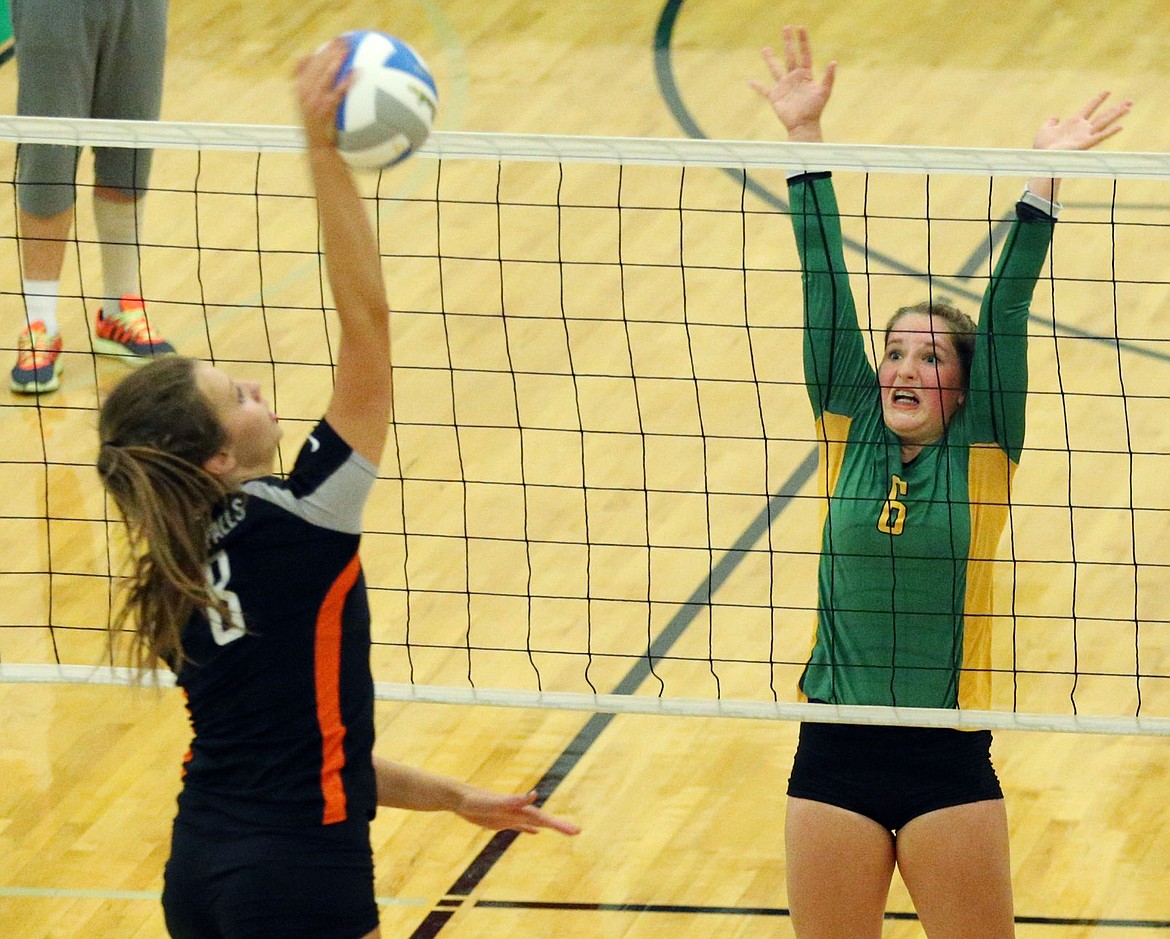 &lt;p&gt;LOREN BENOIT/Press Lakeland's Jalyn Mailhot (6) leaps up near the net to block the spike from Post Falls' Allison Munday (8) during a match between the two schools on Thursday at Lakeland High School. Post Falls won all three sets, 25-12, 25-14 and 25-13.&lt;/p&gt;