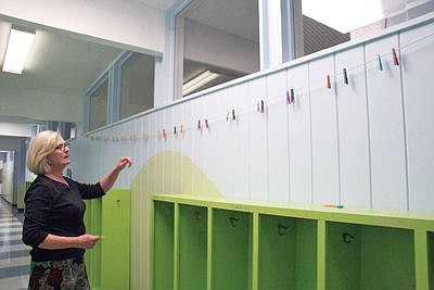 &lt;p&gt;Morrison Elementary Principal Diane Rewerts complimenting the clothes pins above the students&#146; hallway lockers. (Bethany Rolfson/The Western News)&lt;/p&gt;