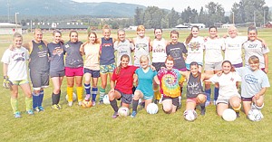 <p>The Lady Loggers soccer team smiles during practice at the Plummer Center. Despite a winless 2011 season, the team has high hopes, and will rely heavily on defense to stay competitive with Kalispell-area teams.</p>