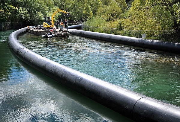 Work on cleaning up the Whitefish River has begun, crews were out on Monday near the Memorial Bridge in downtown.