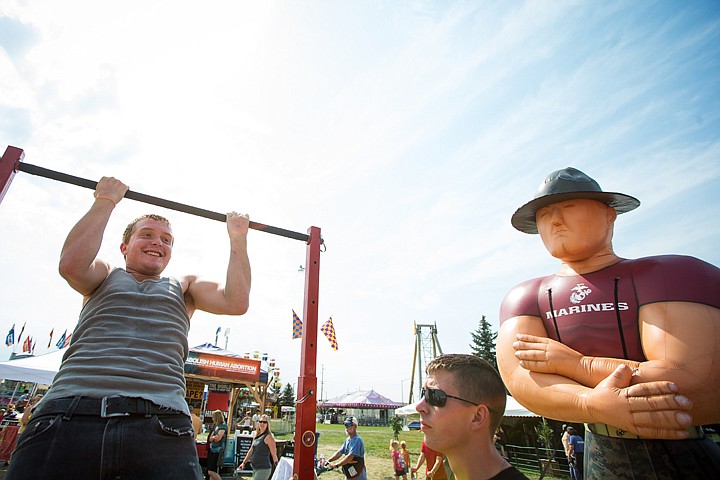 &lt;p&gt;SHAWN GUST/Press John Kreig, 16, of Post Falls, does pull-ups at a Marine recruiting booth as Lance Cpl. Johnathan Miller, below right, spots the teen Thursday at the North Idaho Fair and Rodeo in Coeur d'Alene.&lt;/p&gt;