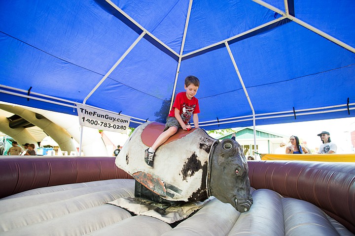 &lt;p&gt;SHAWN GUST/Press Cameron Childer, 8, rides a mechanical bull at the Kootenai County Fairgrounds.&lt;/p&gt;