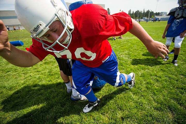 &lt;p&gt;SHAWN GUST/Press Arthur Gustin, 13, makes a move passed a tackling cushion Wednesday during a defensive drill at a football camp for Coeur d'Alene Jr. Tackle players. The free two-day camp, hosted by Coeur d'Alene High School, allowed nearly 150 youth athletes an opportunity to improve their technique as their fall season approaches.&lt;/p&gt;