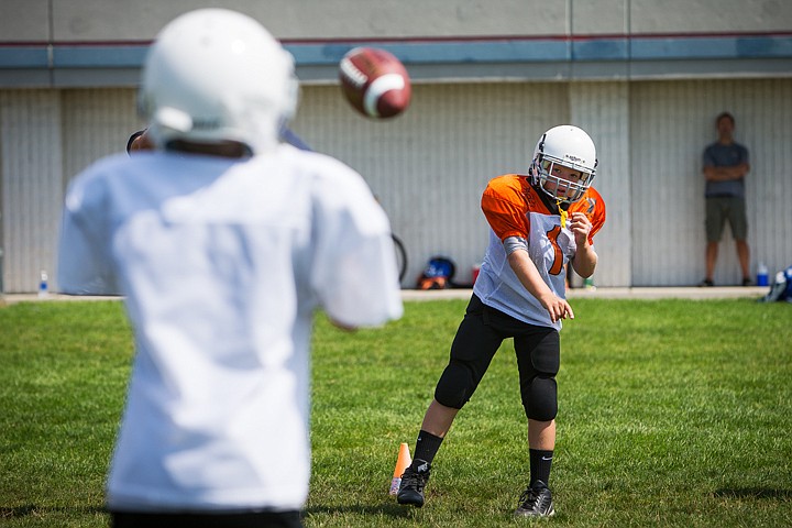 &lt;p&gt;SHAWN GUST/Press Bayley Throm, 12, throws the ball while learning proper throwing technique.&lt;/p&gt;