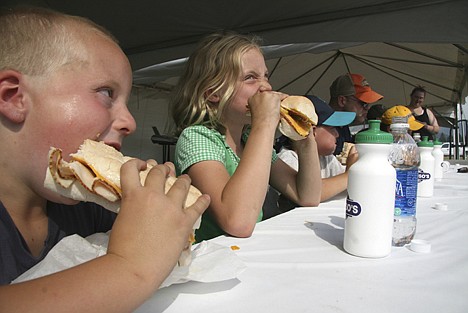 &lt;p&gt;Andrew Karns, 6, left, keeps an eye on his biggest competition and older sister Julia, 10, as the two chomp down on their turkey sandwiches Thursday during a speed eating contest at the North Idaho Fair.&lt;/p&gt;