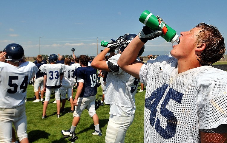 Glacier Defensive Lineman Luke Halliburton takes a drink of a water during practice last Wednesday.