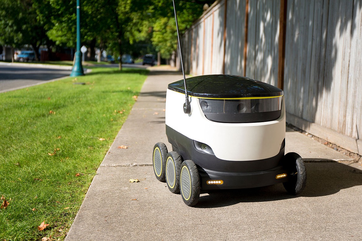 &lt;p&gt;The Starship Technologies delivery robot drives down a sidewalk on 8th Street on Friday in Coeur d'Alene. The six-wheeled, 35-pound autonomous robot carries up to 20 pounds of cargo and uses multiple cameras and sensors to navigate urban areas to deliver goods to customers.&lt;/p&gt;