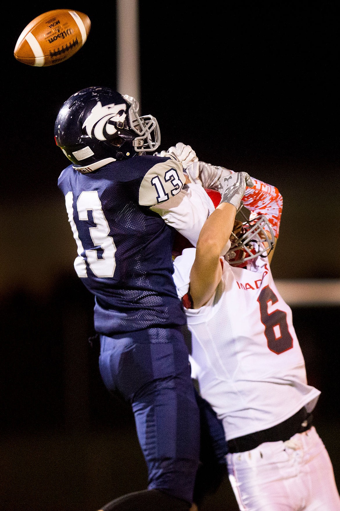 <p>JAKE PARRISH/Press Lake City senior wide receiver Jason Pierard battles for posession of a pass with Branden Edelmayer of Madison on Friday at Lake City High School.</p>