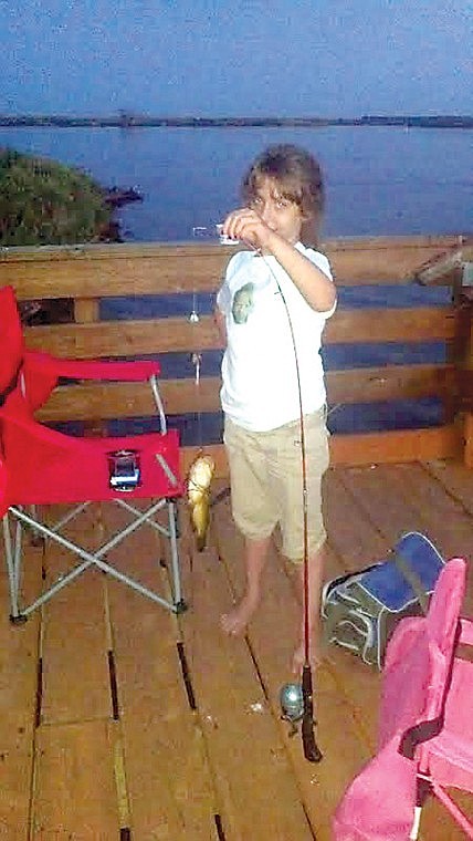 Courtesy photo Kaylee Pardee's first fish: During an Aug. 12
camping trip to Scootney Reservoir with Kaylee Pardee and her
mother, along with boyfriend, Brian McGowan, Kaylee caught her
first fish, a nice fat catfish. As Brian relays the story, "At
about 5:30 or so we headed down to the dock to fish. I helped her
put a worm on the line and she wanted to add a shrimp flavored
marshmallow. I cast her line from her Zebco rod and reel for her
and as most 7-year-old kids do, she began to drift away from
watching her rod. I saw a hit and called her back to the rod. She
picked it up and set the hook like a champ. She had a grin ear to
ear when she landed the catfish. When asked about which bait
attracted the fish she said 'it was the shrimp marshmallow that did
it, cat fish love shrimp.'" Nice catch Kaylee.