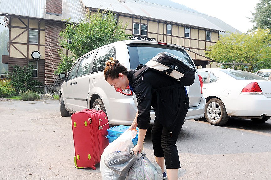 &lt;p&gt;&lt;strong&gt;An Izaak Walton Inn&lt;/strong&gt; worker loads up her belongings on her way out of Essex on Thursday as the Sheep Fire approaches the area. (Aaric Bryan/Daily Inter Lake)&lt;/p&gt;