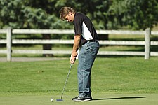 Ronan senior John Romero gets ready to putt during the Ronan Invitational last Friday at the Mission Mountain Golf Course in Ronan.