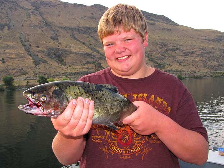 Zach Hartley shows off the jack king he landed below Chelan Falls recently. Unfortunately, a very large king broke off right at the boat.