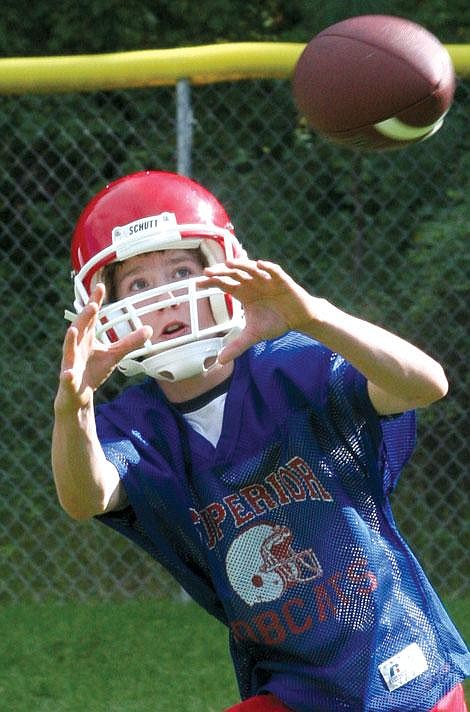 Nick Ianniello/Mineral Independent Superior Bobcat Max Sarmento snags a ball during practice Friday afternoon. Football teams from Alberton, Superior and St. Regis have been gearing up for the season since last Monday.