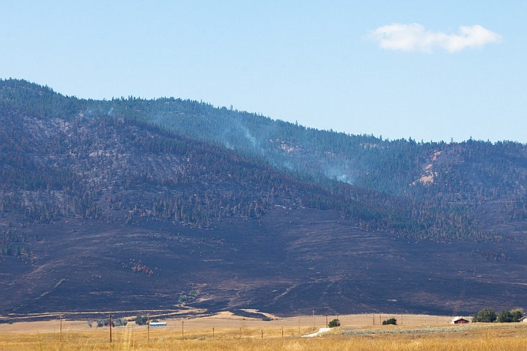&lt;p&gt;Smoke rises Wednesday afternoon from a charred hill side where The West Garceau fire burned west of Polson Wednesday, Aug. 22, 2012 in Polson, Montana.&lt;/p&gt;
