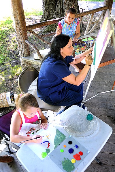 &lt;p&gt;Amy Kumler of Kalispell and her daughters, Acacia, 9, top, and
Anwen, 7, participate in Paint the Mansion on Tuesday at the Conrad
Mansion in Kalispell.&lt;/p&gt;