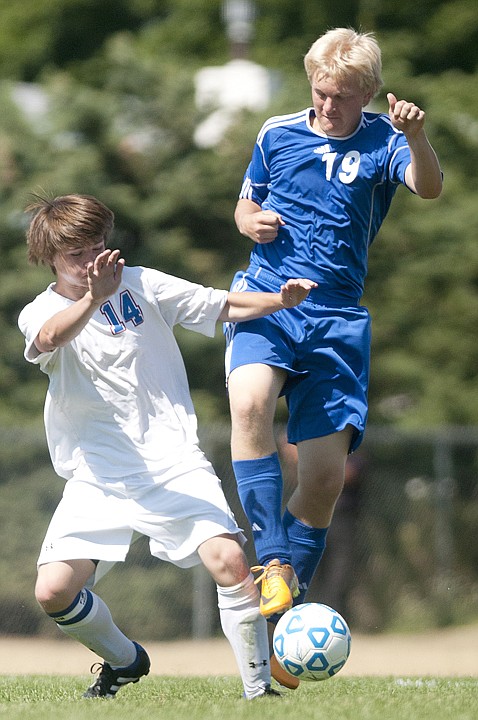 &lt;p&gt;Columbia Falls defenseman Dylan Corbett (14) fights with
Stillwater Christian School's Cole Moore (19) for control of the
ball in Columbia Falls on Saturday afternoon.&lt;/p&gt;