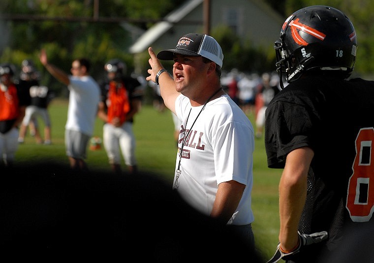 Flathead Head Coach Russell McCarvel provides direction while practicing a play.