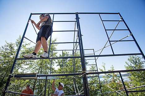 &lt;p&gt;Devin Dresser, with Second Wind Productions Professional Audio Equipment and Services, sets up scaffolding along Coeur d'Alene Lake Drive for the sound system that will be used at the is weekend's hydroplane races.&lt;/p&gt;