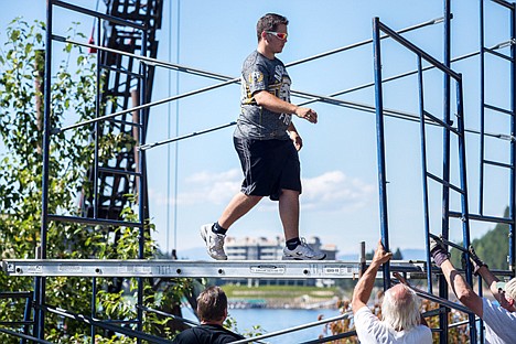 &lt;p&gt;As a crew sets up scaffolding for the sound system which will be used in this weekend's hydroplane races, Devin Dresser, with Second Wind Productions Professional Audio Equipment and Services, walks across a platform Tuesday along Coeur d'Alene Lake Drive.&lt;/p&gt;