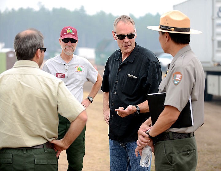 &lt;p&gt;&lt;strong&gt;U.S. Rep. Ryan Zinke&lt;/strong&gt;, R-Mont., talks with Glacier National Park Superintendent Jeff Mow and fire officials on Friday at the command center in West Glacier for the Thompson-Divide Complex. (Brenda Ahearn/Daily Inter Lake)&lt;/p&gt;