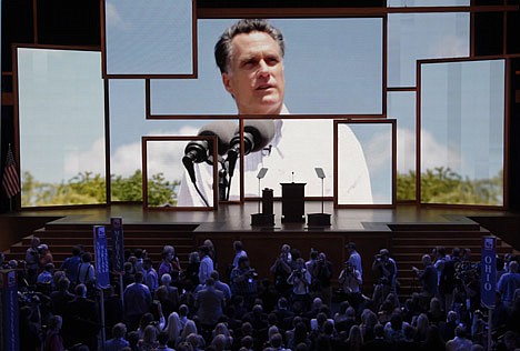 &lt;p&gt;Delegates watch a video presentation during an abbreviated session of the Republican National Convention in Tampa, Fla., on Monday, Aug. 27, 2012. (AP Photo/J. Scott Applewhite)&lt;/p&gt;