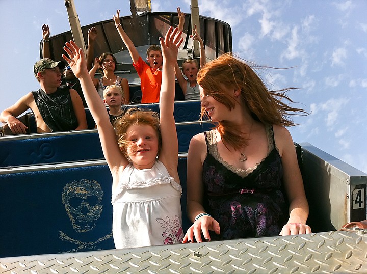 &lt;p&gt;SHAWN GUST/Press Lilian Krous 7, holds her hands in the air while riding the Sea Ray with older sister, Katie Jo, 13, at the fair on Thursday.&lt;/p&gt;
