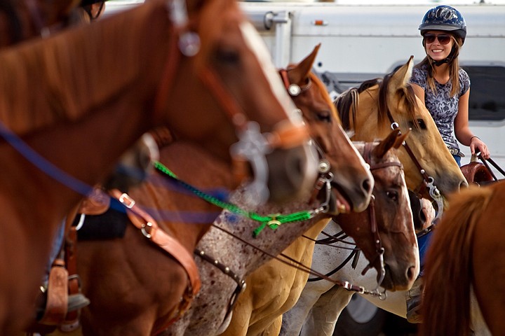 &lt;p&gt;JEROME A. POLLOS/Press Courtney Lyon, one of the Rolling Thunder 4-H Drill Team members, waits alongside her teammates to practice for the opening of the rodeo Friday.&lt;/p&gt;