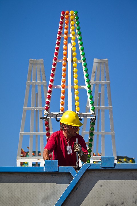 &lt;p&gt;SHAWN GUST/Press Tommy Cernglia, a laborer with Royal West Entertainment, works to erect a carnival ride Tuesday in preparations for today's opening of the North Idaho Fair and Rodeo in Coeur d'Alene.&lt;/p&gt;