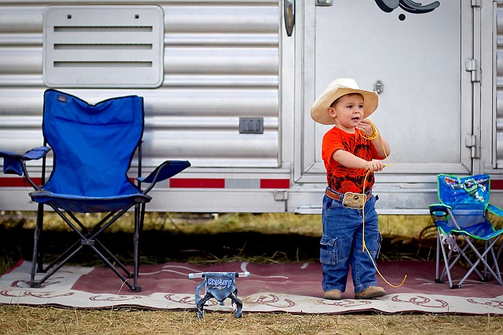 &lt;p&gt;Radley Griggs, 2, plays with a rope while standing by his parents' livestock trailer Friday near the rodeo arena at the Kootenai County Fairgrounds.&lt;/p&gt;