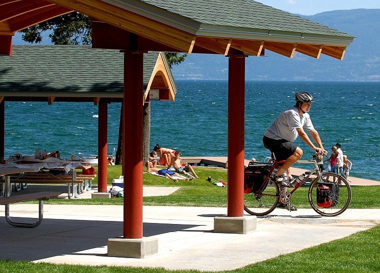 Cheyenne Allen rides his bike past the new pavilions at Volunteer Park in Lakeside. &#147;It's the icing on the cake for the community,&#148; said Allen, who has lived in Lakeside for more than 20 years. The new county park, valued at $3 million, was developed and donated to the county by Bruce Ennis and Maggie Davis.