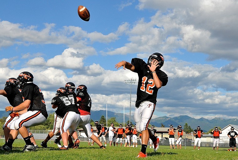 Flathead Quarterback Mike VanArendonk lets a pass fly during Monday afternoon's practice inside Legends Stadium.