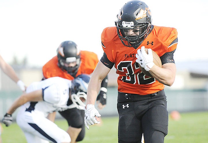 &lt;p&gt;Flathead running back Josh McCracken runs for a touchdown on the Braves' opening drive against Great Falls High at Legends Stadium Friday night. (Aaric Bryan/Daily Inter Lake)&lt;/p&gt;