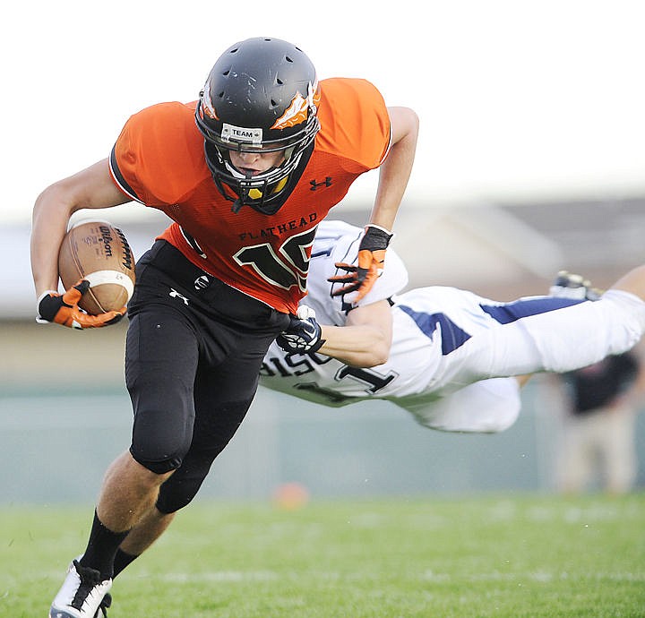 &lt;p&gt;Flathead's James Flannigan sheds the tackle of a Great Falls defender during the first quarter on Friday. (Aaric Bryan/Daily Inter Lake)&lt;/p&gt;