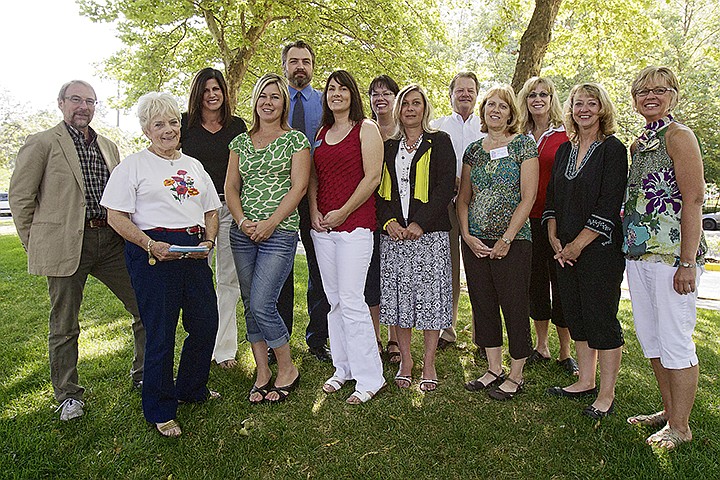 &lt;p&gt;JEROME A. POLLOS/Press The Coeur d'Alene Garden Club presented nine local non-profit organizations Tuesday with funds totaling $10,000 which was raised through the club's annual garden tour. Photographed from left are, Vern Harvey, with Hayden Meadows Elementary, Bonnie Warwick, the garden tour coordinator, Sandra Gunn, with CASA, Janie Givas, with Children's Village, Joe Robinson, with North Idaho Violence and Prevention Center, Katie Simmons, with ICARE, Kim Normand, with Shared Harvest Community Garden, Theresa Staples, with North Idaho Violence and Prevention Center, John Corcoran and Sally Richards, both with ElderHelp, Pam Noah, with the North Idaho College Foundation, Dori Peck, with Kootenai Humane Society, and Karen Carstens, the Coeur d'Alene Garden Club president.&lt;/p&gt;