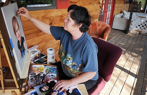 Leah Lambert paints a portrait on Wednesday, August 4, at Walking Bear Ranch north of Whitefish. Lambert moved into the ranch from Kalispell the week prior.