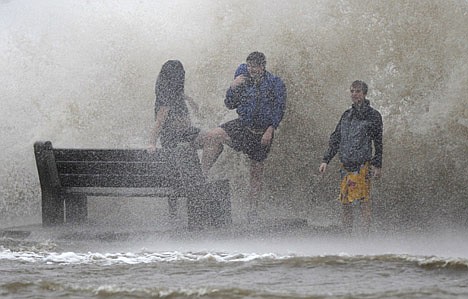 &lt;p&gt;People walk in the storm surge from Isaac, on Lakeshore Drive along Lake Pontchartrain, as the storm approaches landfall, in New Orleans, Tuesday, Aug. 28, 2012. The storm was arriving at the seventh anniversary of Hurricane Katrina, which devastated Louisiana and Mississippi when it struck on Aug. 29, 2005. (AP Photo/Gerald Herbert)&lt;/p&gt;