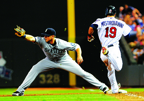 &lt;p&gt;Seattle Mariners first baseman Justin Smoak, left, is shown against the Minnesota Twins in the first inning of a baseball game Tuesday, Aug. 28, 2012, in Minneapolis. (AP Photo/Jim Mone)&lt;/p&gt;