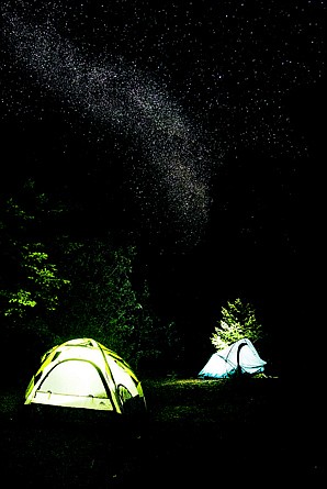 <p>Chris Celentano and Karen Wilmoth camp along Lake Pend Oreille under the Milky Way.</p>