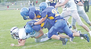 &lt;p&gt;QB Christian Trocke tackled by Josh Bowers, center, Skyler Higareda, right and Bryce Gustin, second quarter.&lt;/p&gt;