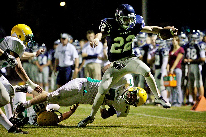 &lt;p&gt;JEROME A. POLLOS/Press Lake City High's Levi Hewitt reaches for the goal line as Troy Carr from Lakeland High flies toward his legs to make the stop Friday during the Timberwolves 46-21 win over the Hawks.&lt;/p&gt;