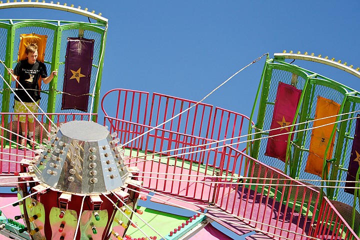 &lt;p&gt;JEROME A. POLLOS/Press Gable Cross, 12, spins above the midway Friday on the Round Up ride at the North Idaho Fair.&lt;/p&gt;