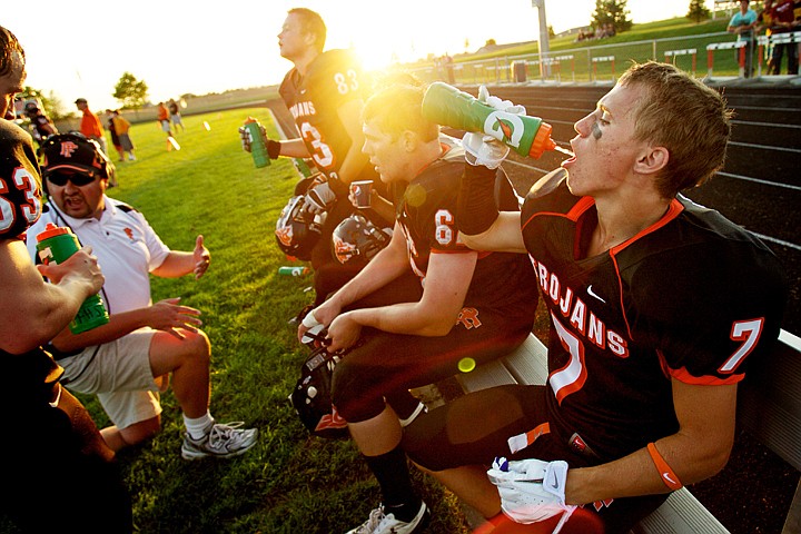 &lt;p&gt;JEROME A. POLLOS/Press Post Falls High's Mitch Crain takes a drink of water while resting from a series of defensive plays Friday against Lewiston High during the Trojan's 29-16 win over the Bengals.&lt;/p&gt;