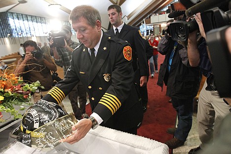 &lt;p&gt;St. Bernard Fire Chief Tommy Stone places a firefighter helmet in a &quot;Katrina casket&quot; during an Ecumenical funeral service for Hurricane Katrina Saturday at Our Lady of Prompt Succor Catholic Church in Chalmette, La., one day before the fifth anniversary of the storm, which took over 1000 lives and devastated the region.&lt;/p&gt;