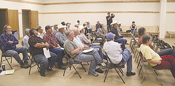 &lt;p&gt;A crowd listens to an answer from FJBC representatives last week in Arlee.&lt;/p&gt;