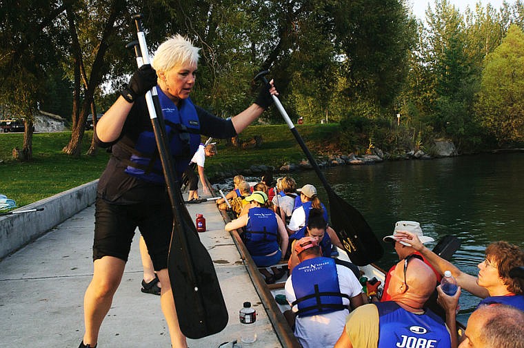 &lt;p&gt;Sonya French, left, of Team Flathead DragonFlies collects paddles at the dock Wednesday evening after a Dragonboat practice in Somers Bay on Flathead Lake. Aug. 28, 2013 in Somers, Montana. (Patrick Cote/Daily Inter Lake)&lt;/p&gt;