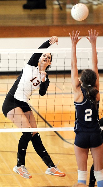 Flathead junior Kylie Schlegel, 13, sends the ball back over the net during the game against Great Falls on Saturday in Kalispell. Flathead won the match up three games to one.