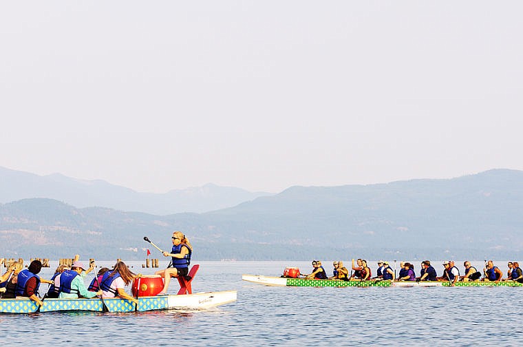 &lt;p&gt;Members of Team Flathead DragonFlies, right, watch as Team Major Threat's boat passes in Somers Bay on Flathead Lake. Aug. 28, 2013 in Somers, Montana. (Patrick Cote/Daily Inter Lake)&lt;/p&gt;